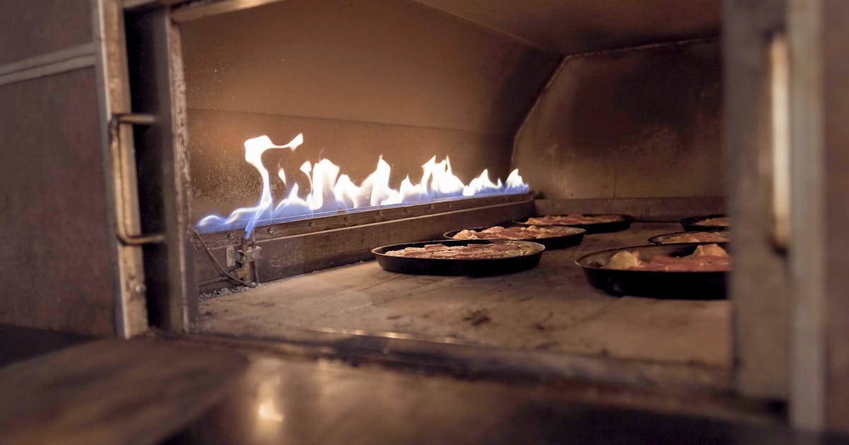 Wood fired pizza restaurant with warm ambient lighting
